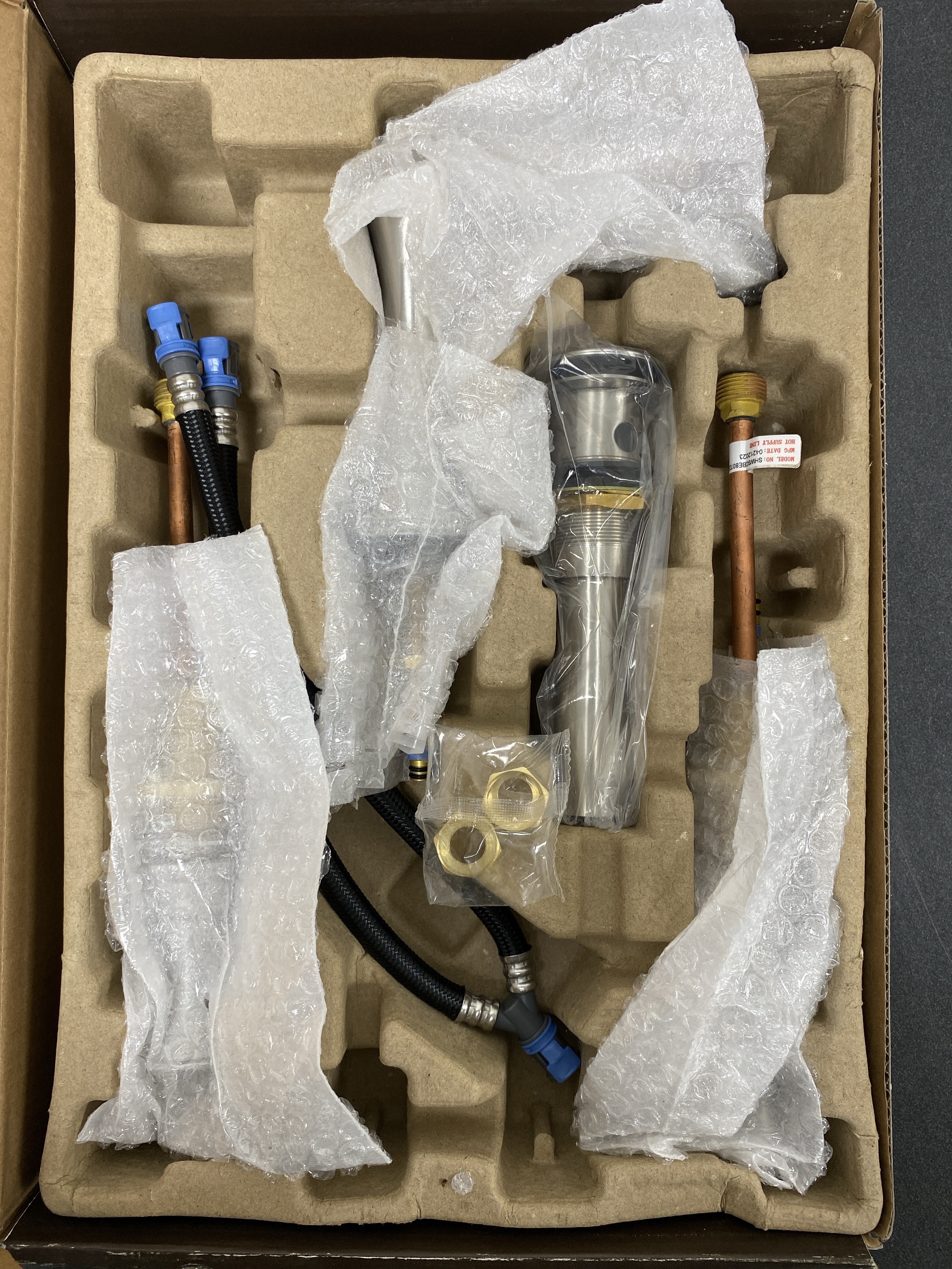 Actual inventory photograph: Signature Hardware 480488 Beasley 1.2 GPM Widespread Bathroom Faucet with Pop-Up Drain Assembly - Brushed Nickel