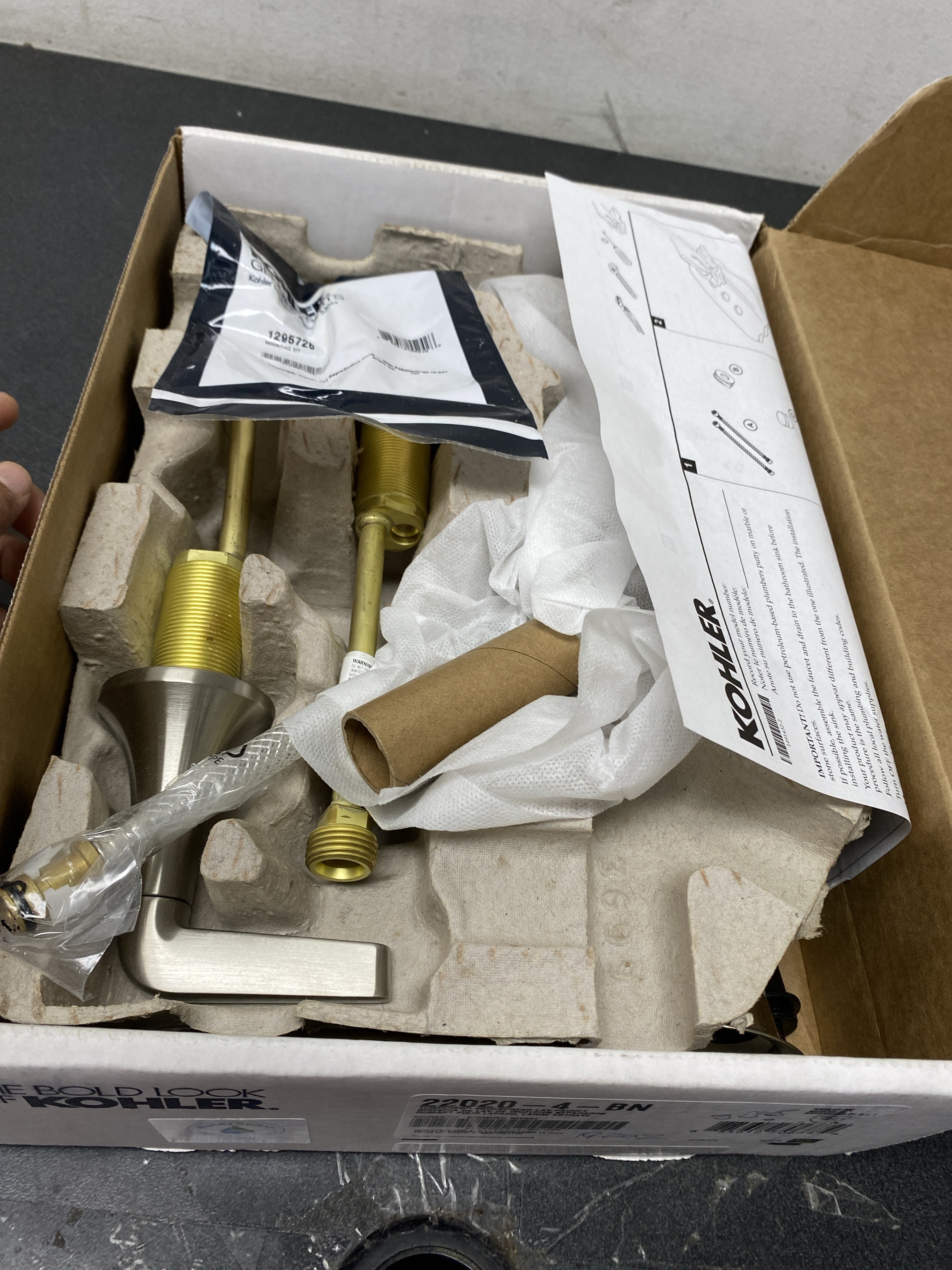 Actual inventory photograph: Kohler K-22020-4-BN Tempered 1.2 GPM Widespread Bathroom Faucet with UltraGlide and Pop-Up Drain Assembly - Vibrant Brushed Nickel
