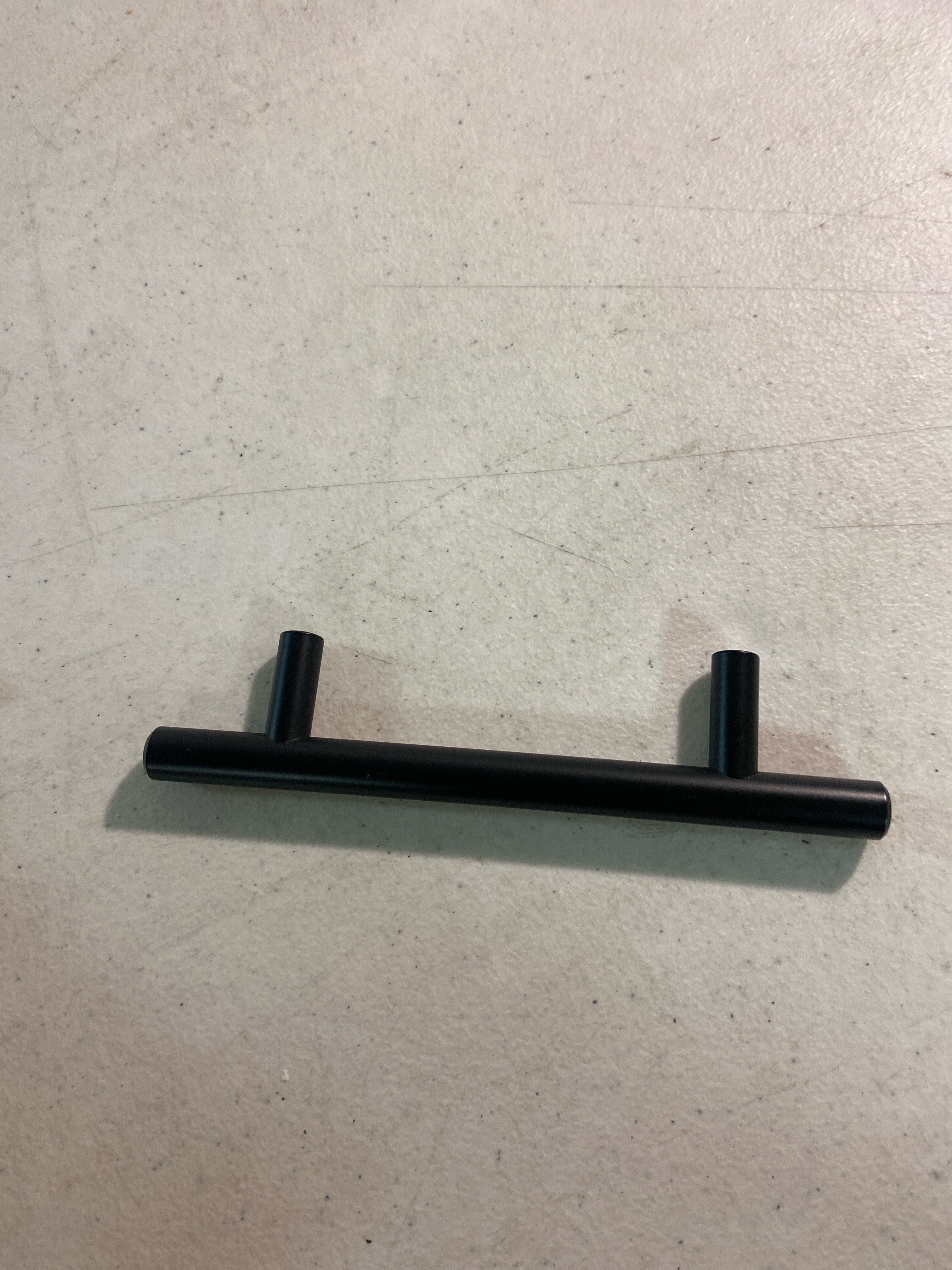 Actual inventory photograph: Signature Hardware 489515 Lazzara 12 Inch Center to Center Black Leather Appliance Pull - Matte Black