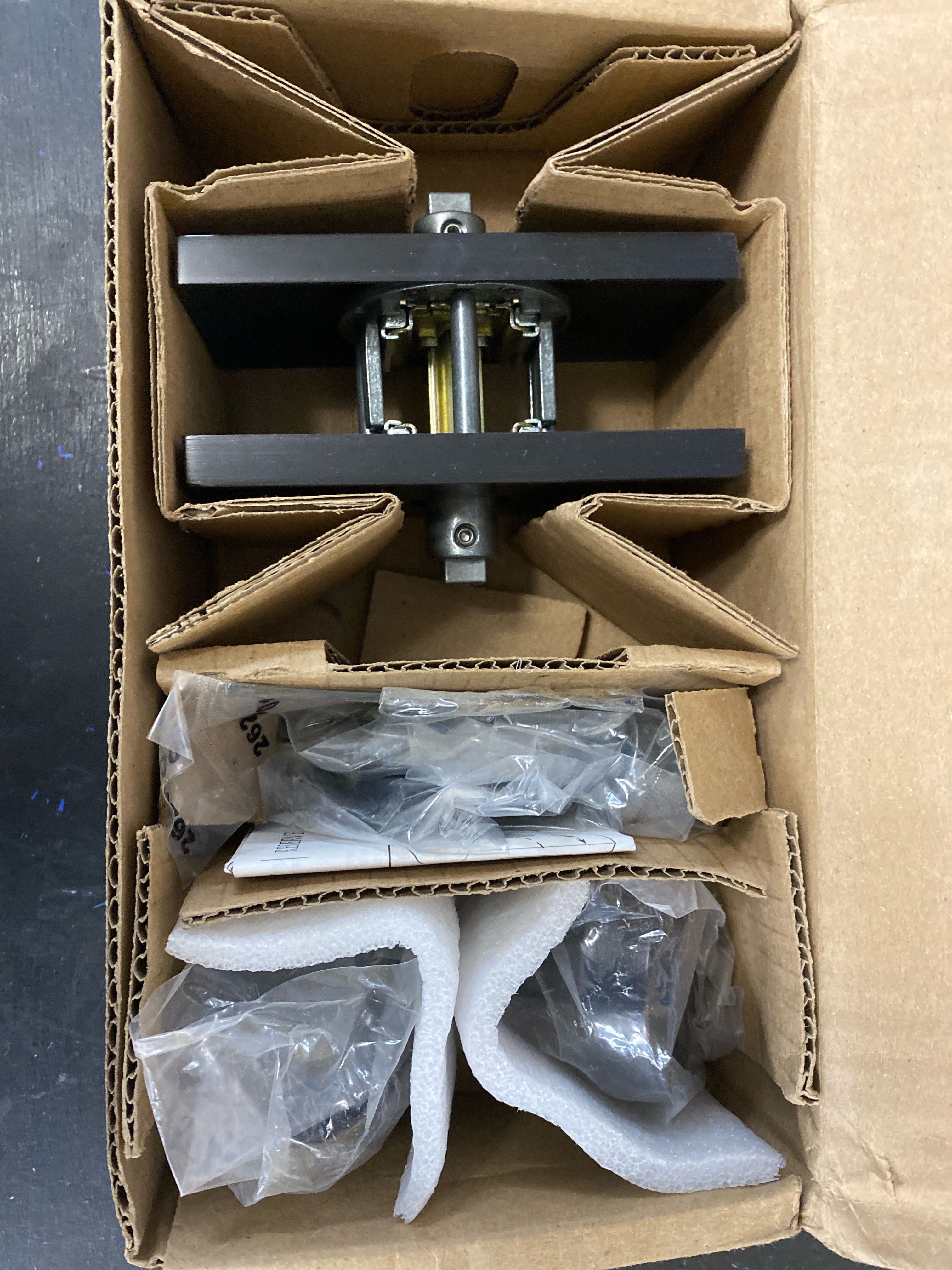 Actual inventory photograph: Baldwin PSCONCFR112 Contemporary Passage Door Knob Set with 5 Inch Rectangle Rose from the Reserve Collection - Venetian Bronze
