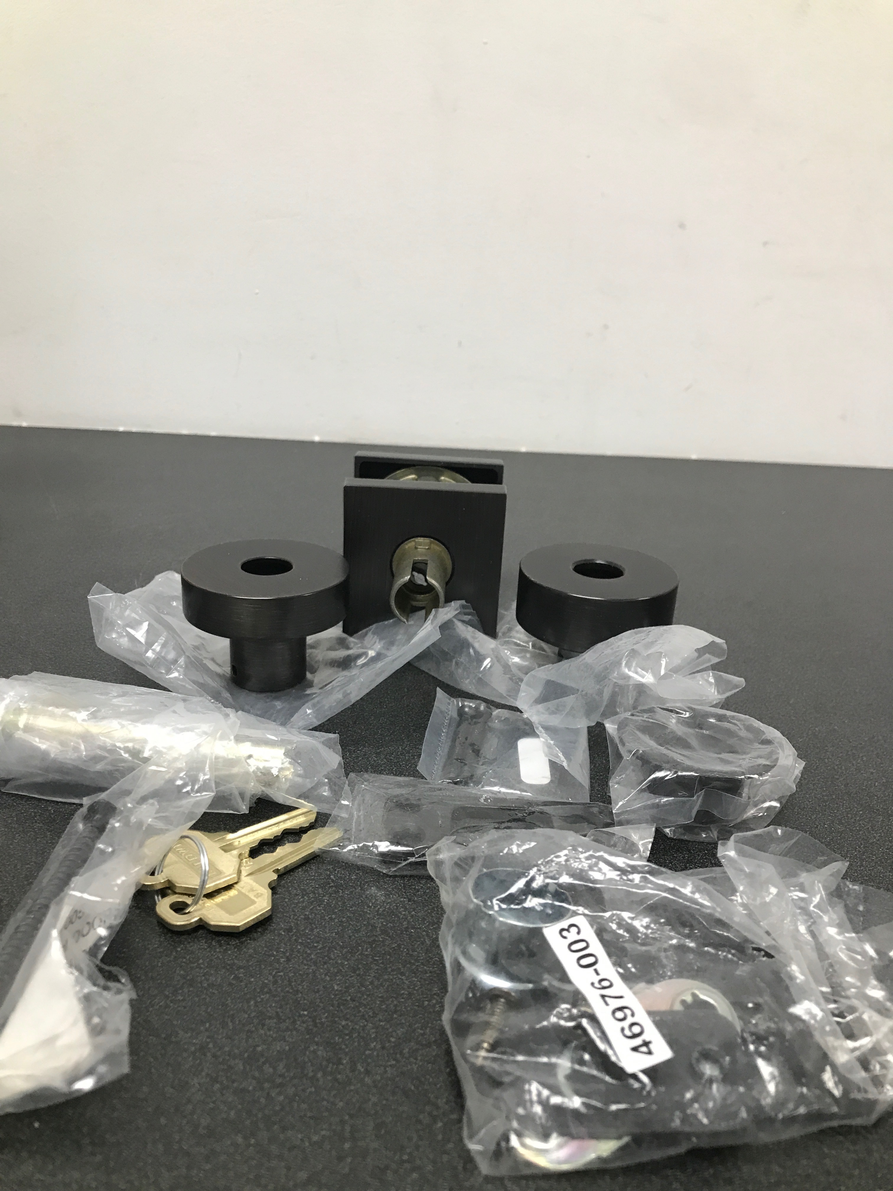 Actual inventory photograph: Baldwin ENCONCSR112 Contemporary Single Cylinder Keyed Entry Door Knob with Square Rose - Venetian Bronze