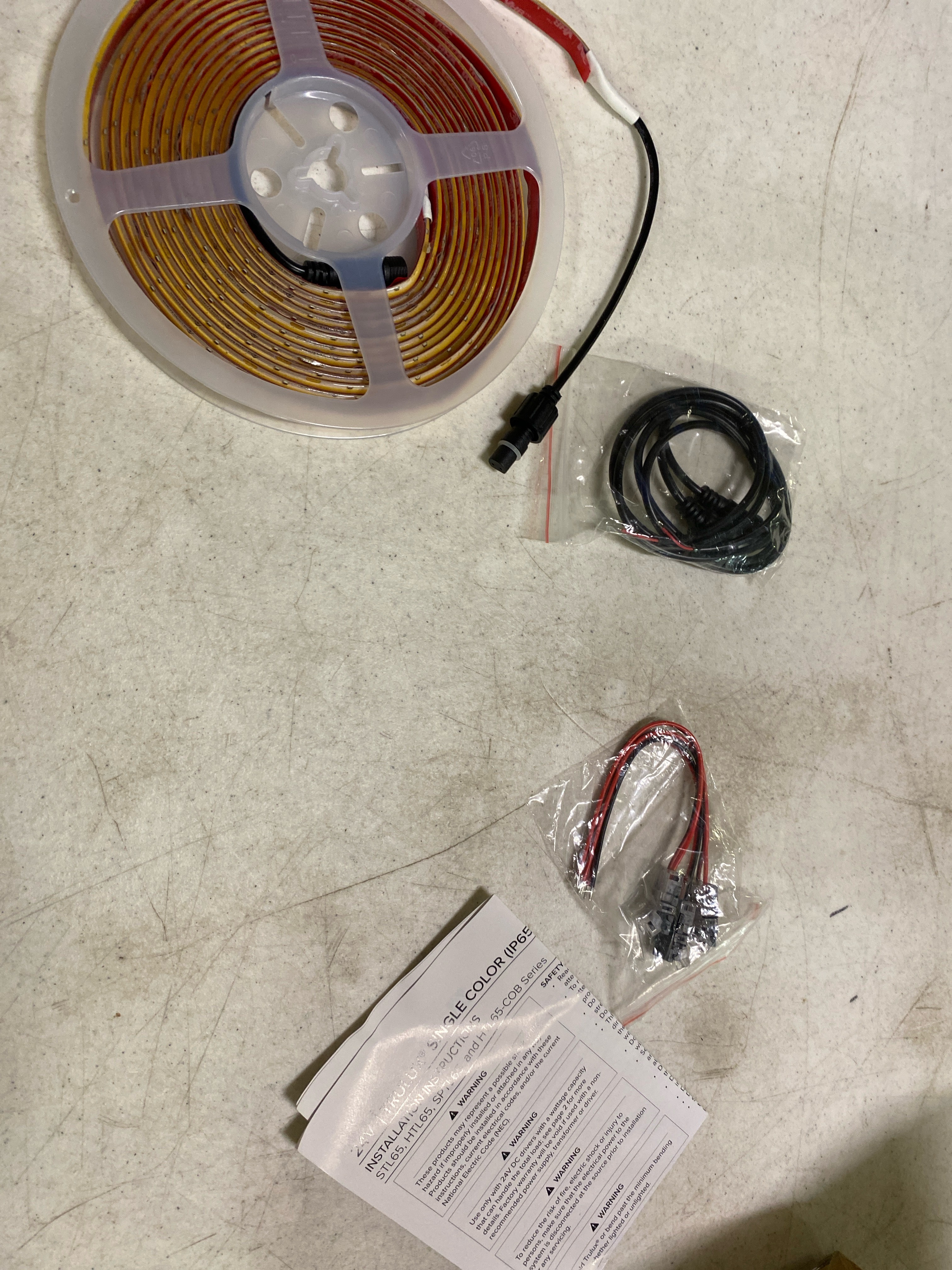 Actual inventory photograph: American Lighting HTL65-COB-WW-16 Trulux High Output Dotless LED Strip Light - 16.4 ft. Reel - IP65 Wet Location - 3000K - 5 W by ft. - 379 Lumens by ft. - 24 V, White