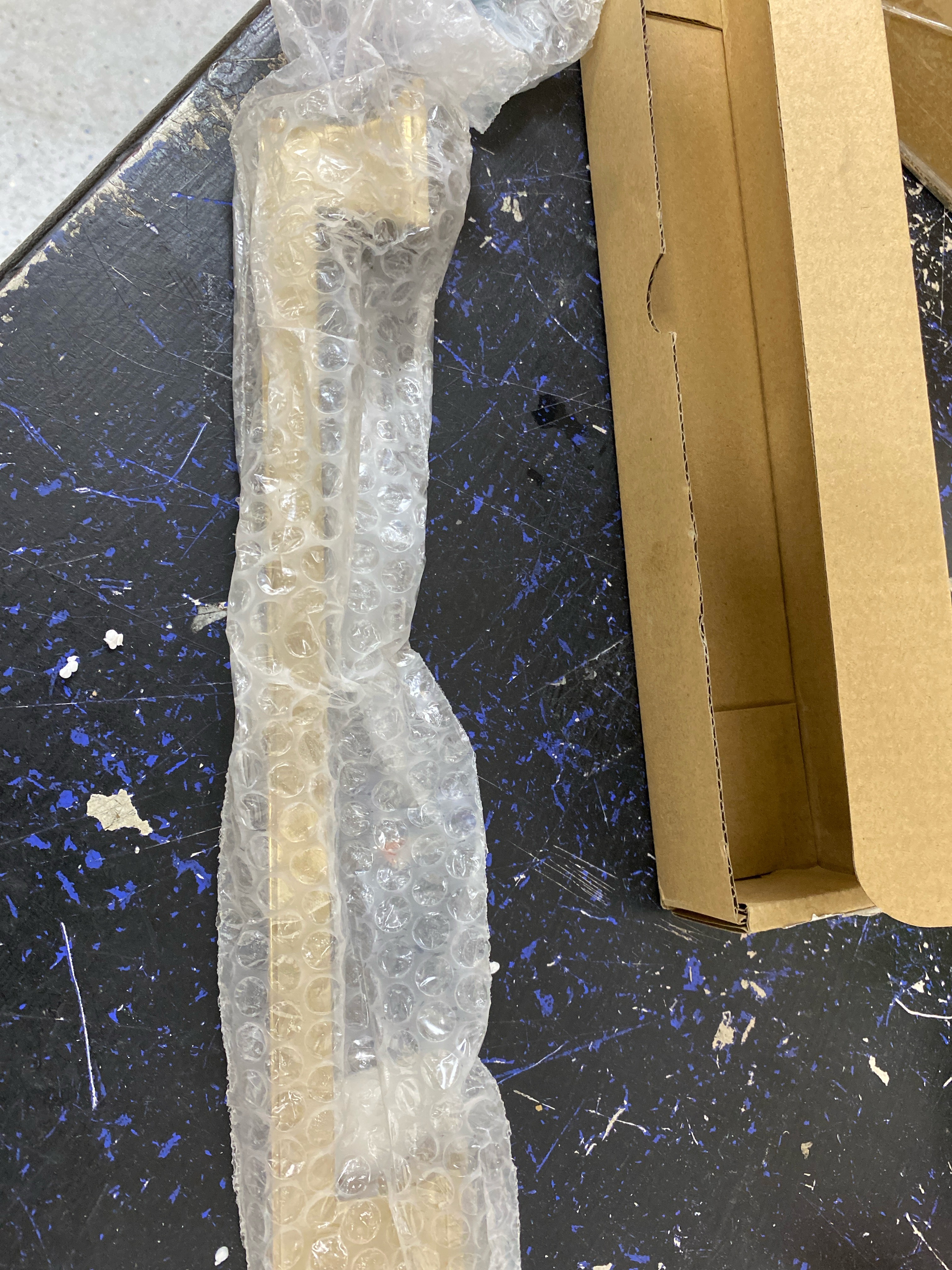 Actual inventory photograph: Belwith Keeler B078830-CBZ Brownstone 12" Center to Center Slim Grip Appliance Handle / Appliance Pull - Champagne Bronze